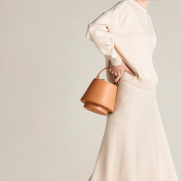 Minimalist Beige Outfit with Stylish Tan Handbag and Soft Aesthe