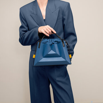 Fashionable Blue Handbag Paired with Modern Couture Blue Suit