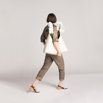 Stylish Individual Walking with Designer Bag and Elegant Floral 
