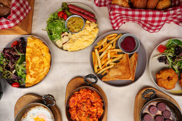 Delicious breakfast spread with various dishes and sides