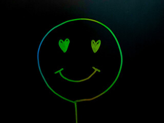 Happy and smile face neon on black background	
