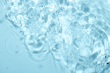Clear Water Ripples and Bubbles Under Soft Blue Light Reflection