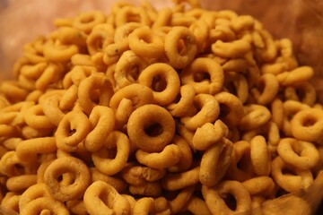 small murukku or ring murukku is a Indian homemade snack for tea time made from lentils and rice deep fried in coconut oil	