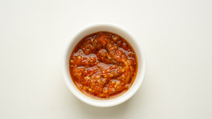 Sambel or Sambal Tomat, made from tomatoes, chilies, salt, sugar, garlic, shallots and shrimp paste (terasi). Indonesian food.
