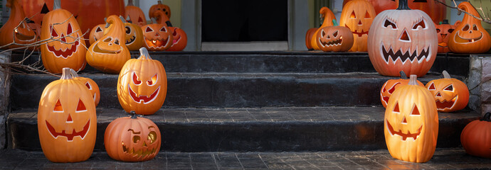 Halloween jack-o-lantern pumpkin decorations on back porch