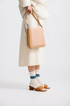 Fashionable Outfit Featuring Neutral Tones with Stylish Accessor