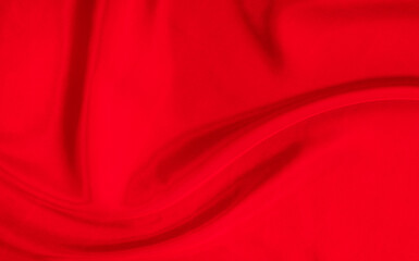 Black red satin dark fabric texture luxurious shiny that is abstract silk cloth background with patterns soft waves blur beautiful.