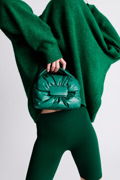 Fashionable Green Outfit Featuring Knitwear and Stylish Accessor