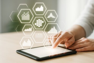 Business analytics technology interface with glowing hexagon icons and charts on touch tablet screen on light wooden background concept.