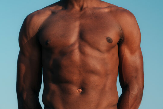 Unrecognisable athletic young black man with fit abs and torso 