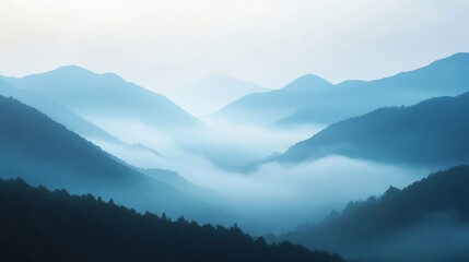 Fototapeta premium 9.Morning Mist Over Mountains, Soft Fog Rolling Through Peaks, Mysterious and Serene, Natureâ€™s Calm