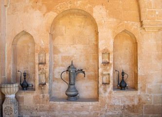Antique Decorative Ceramic Jugs in Historic Stone Hollows