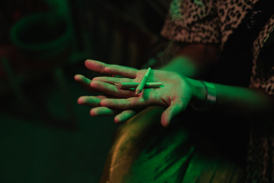 Hands holding two joints