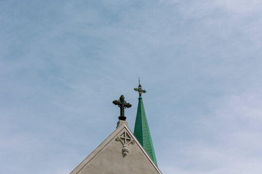 Church Spire and Cross Under Clear Sky.