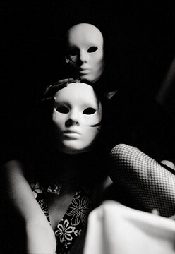 Two woman with hidden faces