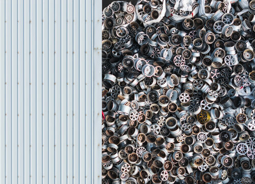 Used Car Wheels Piled at Recycling Plant for Metal Waste Recycli