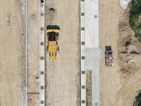Construction site land preparation with heavy machinery