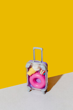 plastic case with float, cone and headphones on yellow