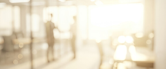 Two people blurred in a bright office space with sleek glass walls, creating a modern, open, and collaborative working environment.