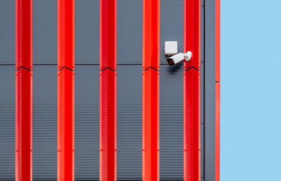 Outdoor security camera on modern building wall