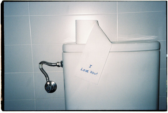 toilet paper reveals a love message, 35mm