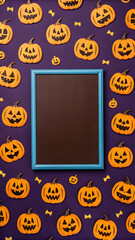 Empty blue framed chalkboard sits centrally on a dark purple background covered in cheerful carved halloween pumpkins and small candy corn shapes
