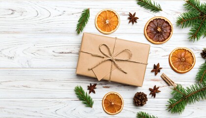 Festive holiday gift wrapping concept with natural decor like dried citrus and spices on a wood background