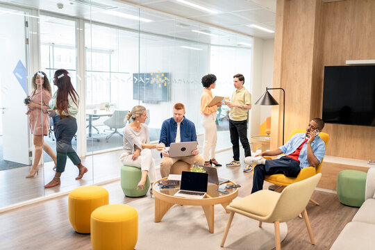 Businesspeople collaborating in modern office space