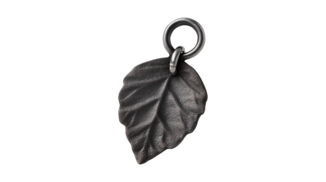 An isolated rustic dark metal leaf charm with a vintage, gothic feel for jewelry making - Powered by Adobe