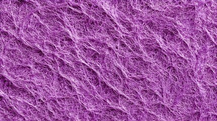 Fototapeta premium Purple fibrous texture close-up, abstract macro pattern of intertwined threads and fine fibers, seamless organic background for design, textile art and creative surfaces.