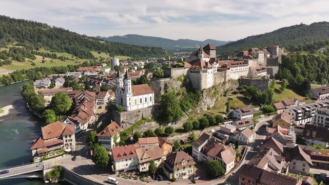 aerial view of aarburg castle and church rising above town by aare river switzerland