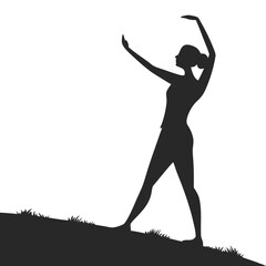 silhouette of a young woman dancing