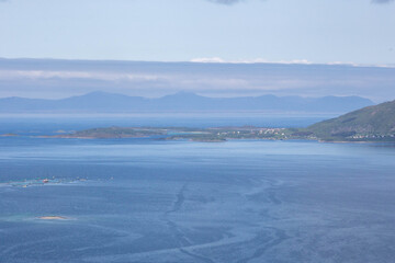 Scenic views of Norwegian fjords, snowy mountains, rural roads, seagulls, farm animals, and lush summer landscapes across Lofoten and Northern Norway in stunning Scandinavian nature.