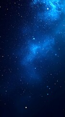 Obraz premium A deep blue night sky filled with countless stars and a hazy nebula