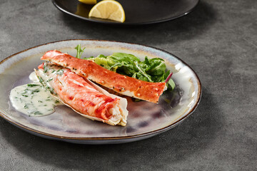 Kamchatka crab phalanges with mixed greens and sauce, bright natural lighting, closeup composition