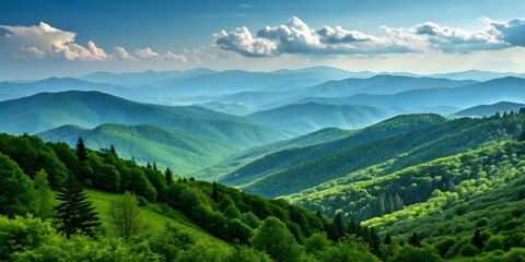 Fototapeta premium Mountain Majesty: A breathtaking landscape unfolds, revealing layers of undulating mountains painted in hues of green and blue, topped with fluffy clouds, evoking a sense of tranquility and awe.