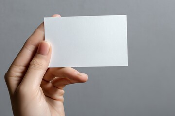 Fototapeta premium Blank white business card held in hand (1)