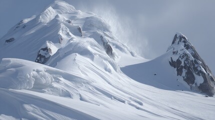 Snowy mountain peak, windswept slopes