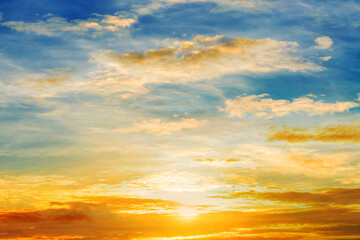 Golden sunset with vibrant clouds and warm tones