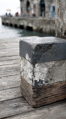 Gray & wood block on dock. Blurry harbor