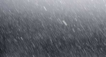An abstract texture background of heavy rain falling in diagonal streaks against a dark background.