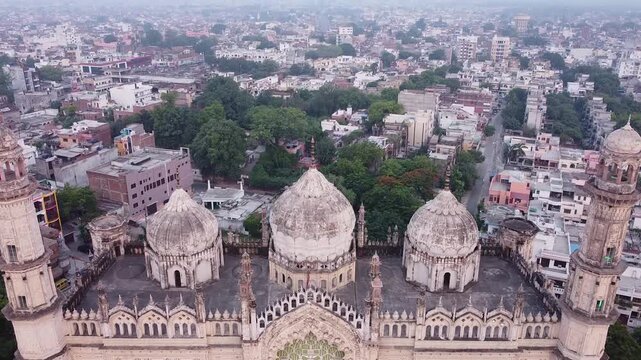 Aerial view of a mosque surrounded by mall houses in lucknow