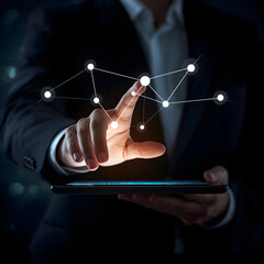 A single hand, lit by the glow of a computer screen, is shown hovering over a tablet. On the screen, a network of nodes and data points represents an AI agent streamlining a business's supply chain