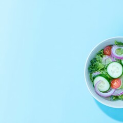 Fresh salad in white bowl on light blue background