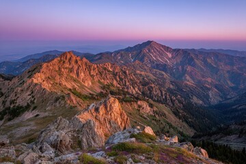 Fototapeta premium Mountain range at dawn. Rocky peaks bathed in sunrise colors