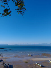 Breathtaking golden sunset casting warm light over a mountain silhouette, with vivid colors and dramatic sky for nature and travel themes
