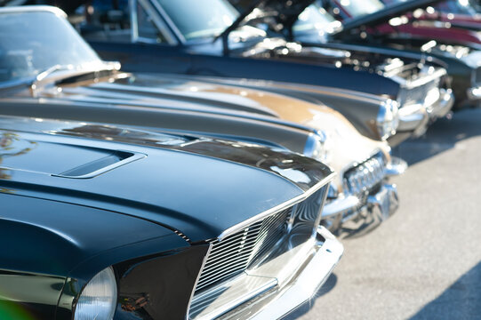 Collection of vintage cars on display at classic automotive exhibition. 