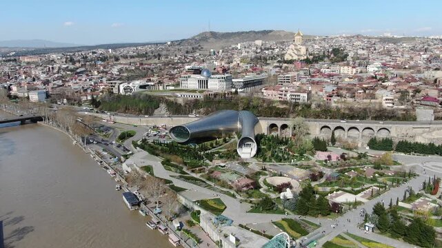 Aerial view of the Peace Bridge and Rike Park in central Tbilisi, Georgia
