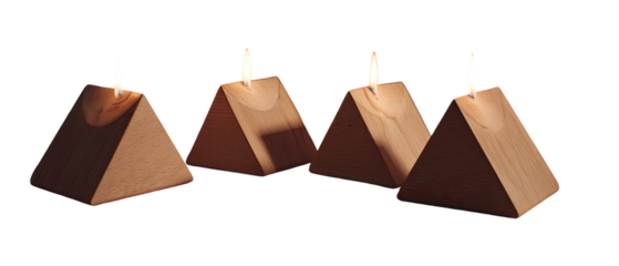Three pyramid-shaped candles with flickering flames