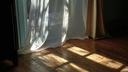 A cotton curtain billowing inward through an open window